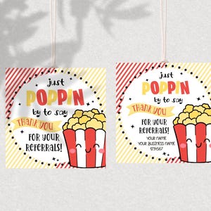 May include: Two red and yellow striped gift tags with a cartoon popcorn bucket and the text "Just Poppin' by to say Thank You for your Referrals!"