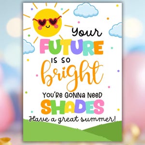 May include: A colorful greeting card with a cheerful sun wearing heart-shaped sunglasses, clouds, and the text "Your Future Is So Bright You're Gonna Need Shades. Have a great summer!" on a white background with a green grassy area.