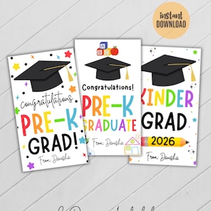 May include: Three graduation cards with black mortarboards and colourful text. The cards say "Congratulations! PRE-K GRAD!", "PRE-K GRADUATE", and "KINDER GRAD 2026". The words are in various colours with star and pencil graphics.