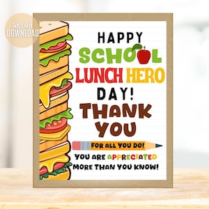May include: A framed print with the text "HAPPY SCHOOL LUNCH HERO DAY! THANK YOU" and a large sandwich illustration. The print includes a pencil graphic and the words "FOR ALL YOU DO! YOU ARE APPRECIATED MORE THAN YOU KNOW!"