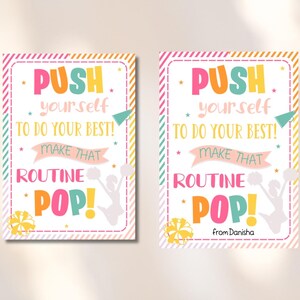 May include: Two motivational posters with a pink, yellow, and green striped background. The posters feature a white silhouette of a cheerleader with pom-poms and the text "PUSH yourself TO DO YOUR BEST! MAKE THAT ROUTINE POP!" The bottom poster also includes the text "from Danisha".