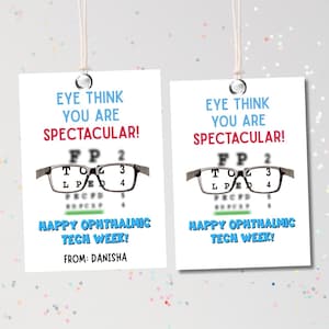May include: Two white gift tags with the text "EYE THINK YOU ARE SPECTACULAR!" in blue and red. Each tag features a pair of eyeglasses and an eye chart. The text "HAPPY OPHTHALMIC TECH WEEK!" is also present, along with the name "DANISHA".