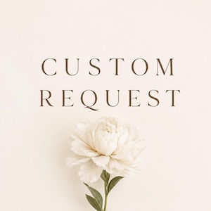 May include: A light cream-colored background features the dark brown text CUSTOM REQUEST centered at the top. Below the text, a single white peony flower with layered petals and green leaves extends upward from the bottom of the frame.