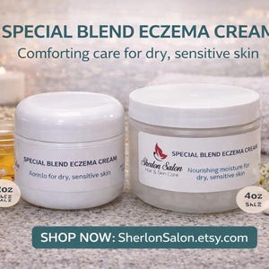 May include: Two white jars of Special Blend Eczema Cream with white lids. The jars are labeled with text indicating the product's purpose for dry, sensitive skin. One jar is labeled 2oz, the other 4oz. The background includes candles, flowers, and a jar of honey.