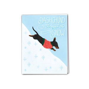 Dachshund à travers la neige | Carte de vacances | Carte de Noël | Drôle de carte de Noël | Carte-cadeau de Noël de chien pour l’amant de chien