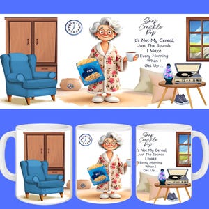 May include: A white ceramic mug featuring a whimsical illustration. The design includes a cartoon of an elderly woman in a floral robe holding a cereal box and a coffee cup. Text on the mug reads "Snap Crackle Pop".
