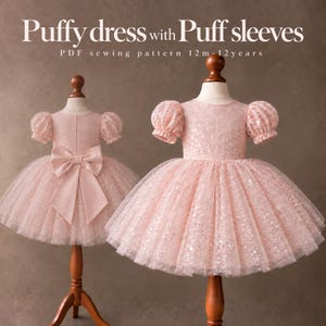 May include: Two light pink dresses with puffy sleeves and sequined tulle skirts displayed on mannequins. The text reads Puffy dress with Puff sleeves PDF sewing pattern 12m-12years. One dress features a large bow on the back.