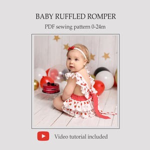 May include: A baby wearing a white ruffled romper with a strawberry print and red polka dot accents. The romper has a bow in the back and is paired with a matching headband. The text reads: BABY RUFFLED ROMPER PDF sewing pattern 0-24m. Video tutorial included.
