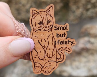 May include: Wooden cutout of a cat with the text "Smol but feisty."