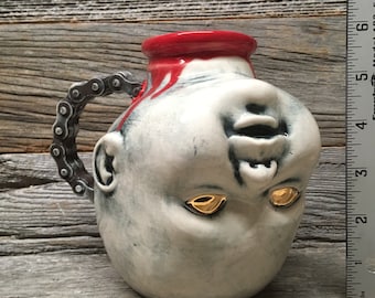 Decapitated Baby Head Mug