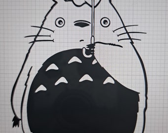 May include: A black and white illustration of Totoro, a character from the animated film My Neighbor Totoro, holding an umbrella. The image features a large, round body with a detailed face and whiskers, and is set against a grid background.