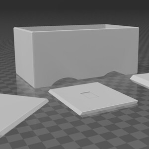 May include: A light gray rectangular box with a curved bottom edge, accompanied by three matching rectangular lids. One lid has a square cutout. The objects are arranged on a checkered surface.