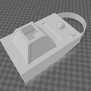 Pode incluir: Um dispositivo retangular branco com uma al&ccedil;a, uma estrutura quadrada elevada e v&aacute;rios elementos circulares e retangulares. O dispositivo parece ser um modelo ou prot&oacute;tipo impresso em 3D.