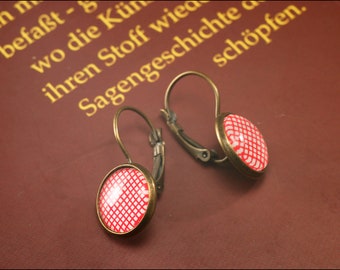 Earrings hanger with pretty red white pattern.