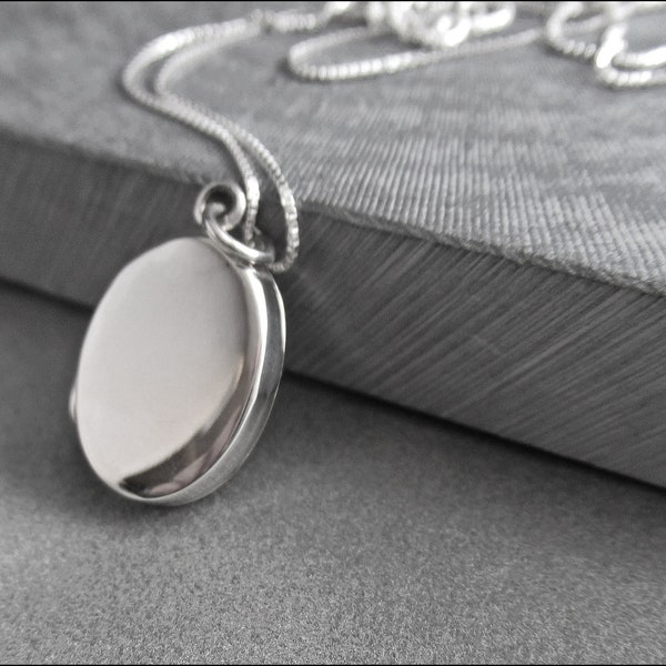 Beautiful small, flat and oval medallion made of real 925 sterling silver with a 925 silver chain