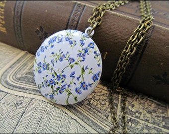 Magnificent flower medallion beautifully enamelled with light blue small flowers