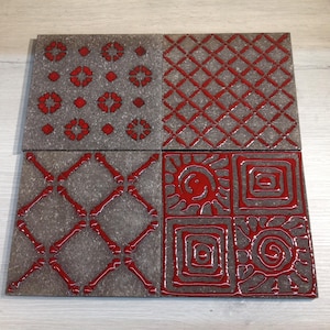 Decorated lava stone tile, tile with red decoration, pot rest, Sicilian wall decoration, ceramics for table decoration,