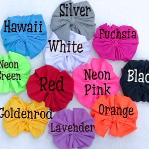 May include: A variety of colors of fabric scrunchies, including neon green, red, goldenrod, lavender, orange, neon pink, black, fuchsia, white, silver, and Hawaii blue.