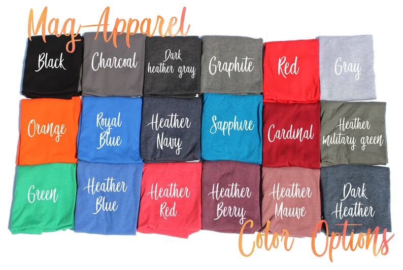 May include: A color chart showing different t-shirt colors available for purchase. The colors include black, charcoal, dark heather gray, graphite, red, gray, orange, royal blue, heather navy, sapphire, cardinal, heather military green, green, heather blue, heather red, heather berry, heather mauve, and dark heather.