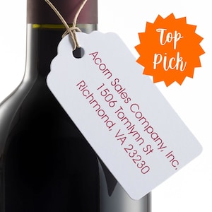 Decorative custom address stamp on a wine bottle tag, featuring a 3-line design ideal for return addresses. This custom 3-line stamp adds elegance and personalization to gifts and correspondence, making it a top pick for unique address labeling.