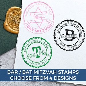 May include: Three circular rubber stamp impressions on white paper. One pink stamp features a Star of David and text reading Tiffany's Bat Mitzvah Saturday April 25, 2029. A green stamp shows a T with Mazel Tov and Tiffany's Bat Mitzvah April 25, 2029. A black stamp shows a B with Mazel Tov and Benjamin's Bar Mitzvah April 25, 2029.