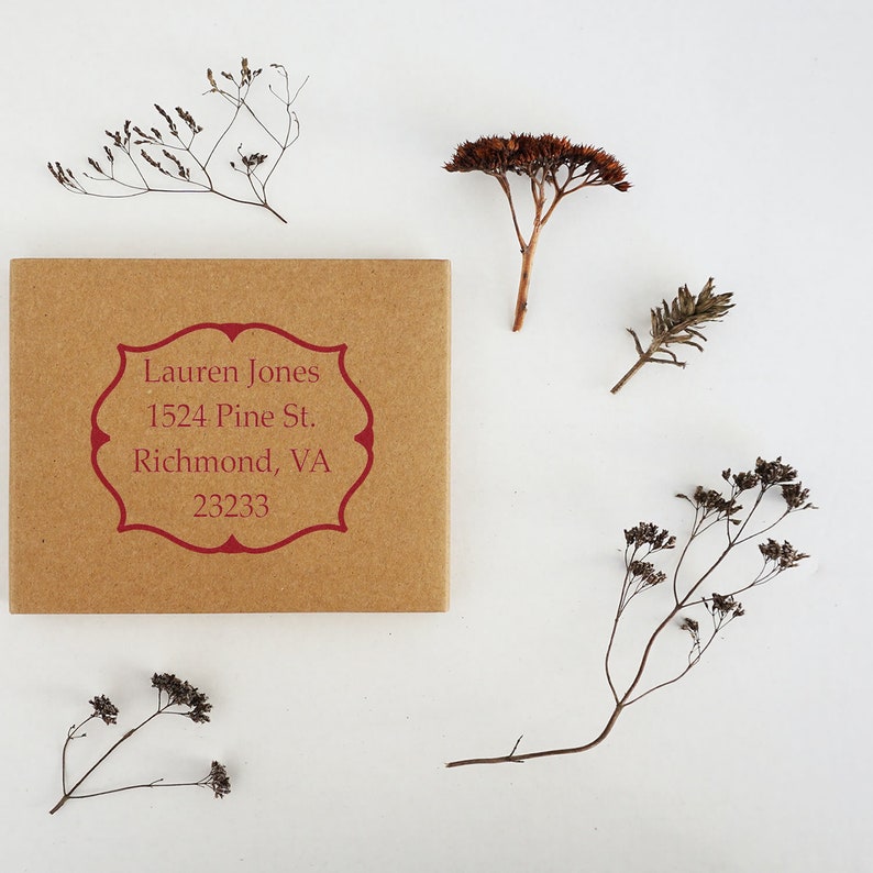 Personalized address stamp on a kraft paper envelope, ideal as an address stamp for realtors. This elegant design makes a perfect gift for realtors, featuring a sample address with decorative dried flowers.