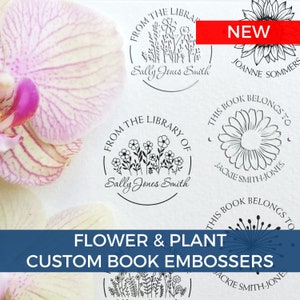 May include: A collection of custom book embossers featuring floral and plant designs. The embossers include text such as "From the Library of" and names. A red "NEW" banner is visible. The image also includes a close-up of a pink and white orchid.