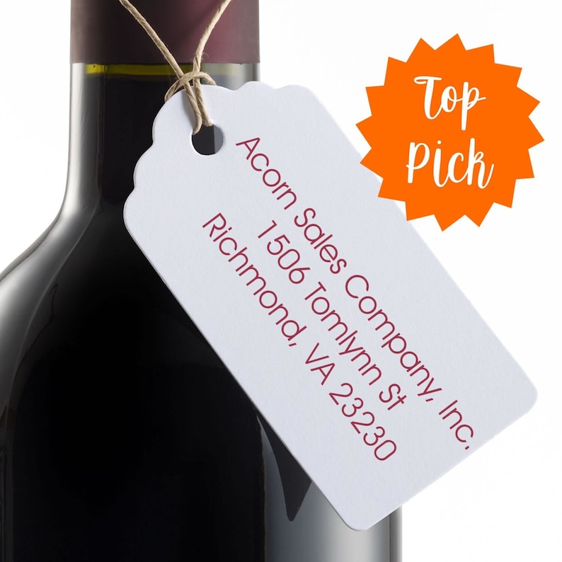 Decorative custom address stamp on a wine bottle tag, featuring a 3-line design ideal for return addresses. This custom 3-line stamp adds elegance and personalization to gifts and correspondence, making it a top pick for unique address labeling.