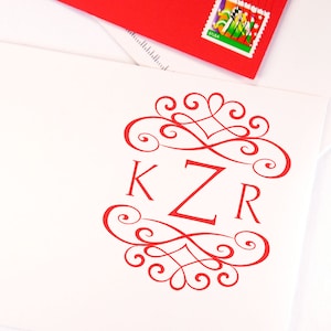 Custom wedding stamp featuring elegant red initials KZR on a white envelope, perfect for personalized invitations. This craft stamp design adds a unique touch to any wedding stationery. Ideal for those seeking a bespoke wedding stamp.