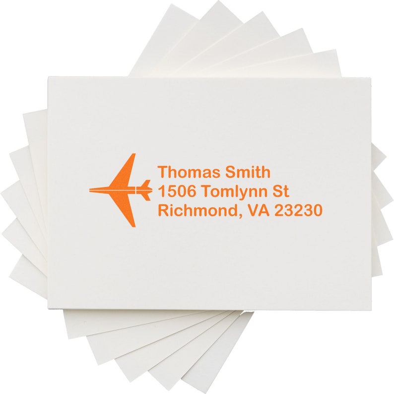 Self-inking stamp with custom design featuring an airplane and personalized address, perfect as a unique gift for travelers or stationery enthusiasts.