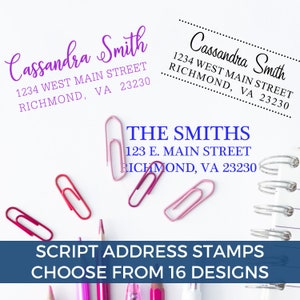 May include: Image featuring three script address stamp designs with names and addresses in different fonts and colors. The text "SCRIPT ADDRESS STAMPS CHOOSE FROM 16 DESIGNS" is at the bottom. Paperclips and pencils are scattered around.