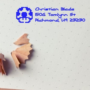 Customizable ink stamp featuring a unique gamers stamp design, perfect for video game themed projects. Ideal for personalizing stationery with a creative touch.