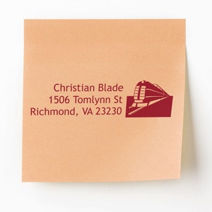 May include: A red and white return address label with a train graphic. The address reads: Christian Blade, 1506 Tomlynn St, Richmond, VA 23230.