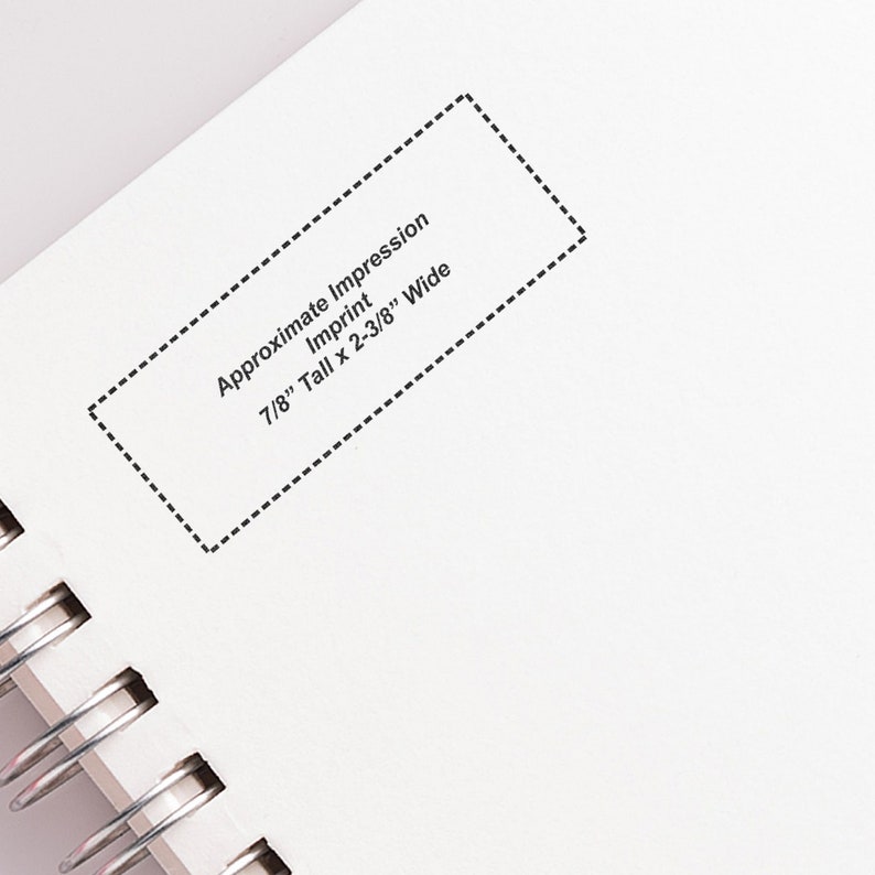 Elegant initial stamp on a notebook page, showcasing a unique address stamp design. Perfect as a personalized stamp gift for stationery enthusiasts, offering a stylish touch to letters and documents.