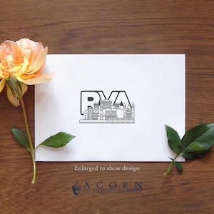 May include: A white card with a black and white illustration of a city skyline with the letters RVA. The text "Enlarged to show design" is below the illustration. The text "ACORN SALES COMPANY INCORPORATED" is below the text "Enlarged to show design".
