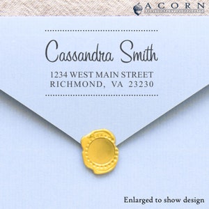 May include: A light blue envelope with a gold wax seal. The envelope has a return address label with the name "Cassandra Smith", the address "1234 West Main Street, Richmond, VA 23230", and the text "ACORN SALES COMPANY INCORPORATED".