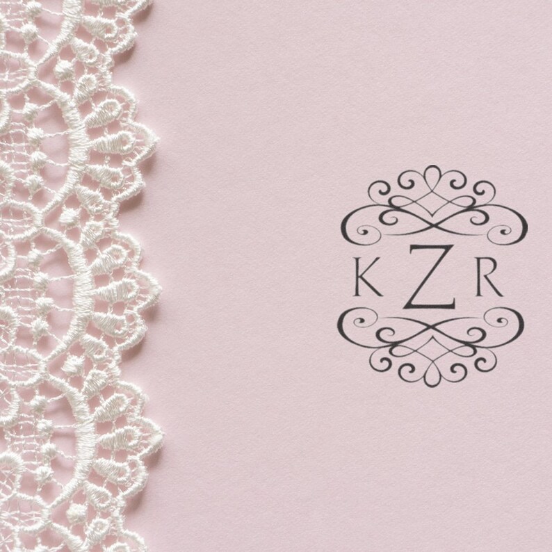 Elegant customizable self-inking rubber stamp design featuring intricate lace pattern and monogram KZR on a soft pink background, perfect for personalized stationery and crafting projects.