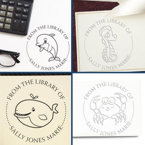 Cute personalized book embosser designs featuring a dolphin, seahorse, whale, and crab. These customized embossing stamps add charm to any library. Perfect for book lovers seeking a unique, cute book embosser for their collection.