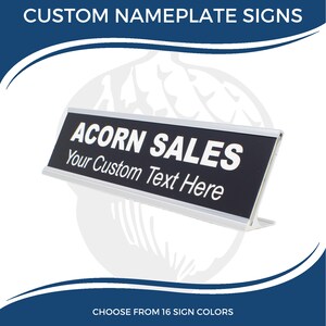 May include: A silver desk nameplate with a black background. The text "ACORN SALES" is printed in white on the nameplate. Below the text is a line that says "Your Custom Text Here".