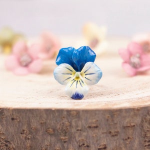 Ring with cold porcelain blue pansy