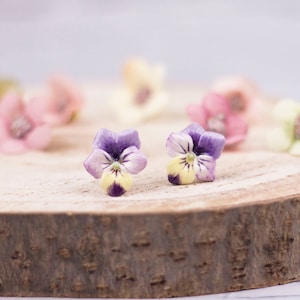 Stud earrings with cold porcelain pansies and steel