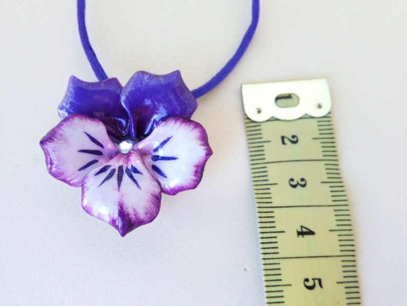 with central rhinestone Necklace with pansy pendant made of cold porcelain