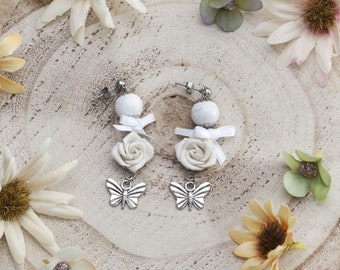 Long stud earrings with cold porcelain white roses, howlite and butterfly charms