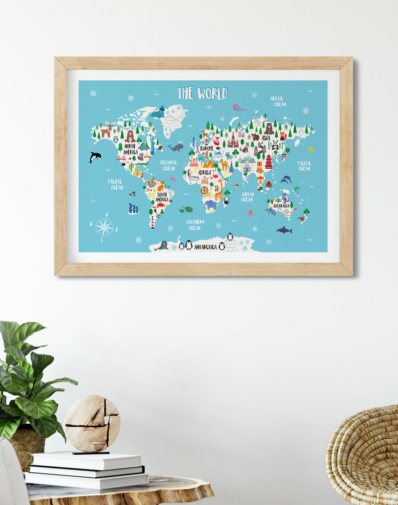 May include: A colourful illustrated world map with animals and landmarks on a light blue background. The map includes the continents of North America, South America, Europe, Asia, Africa, Australia, and Antarctica. The oceans are labelled: Pacific Ocean, Atlantic Ocean, Indian Ocean, Arctic Ocean, and Southern Ocean.