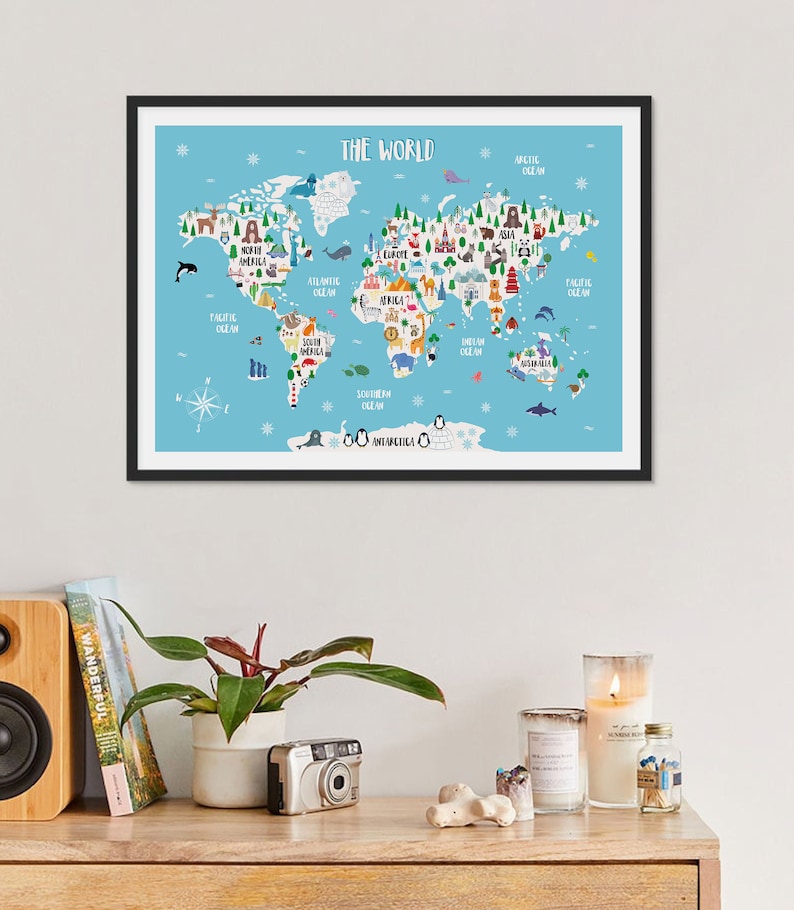 May include: A framed world map with a blue background and colourful illustrations of animals, landmarks, and cities. The map includes the text "THE WORLD" at the top and names of continents and oceans.