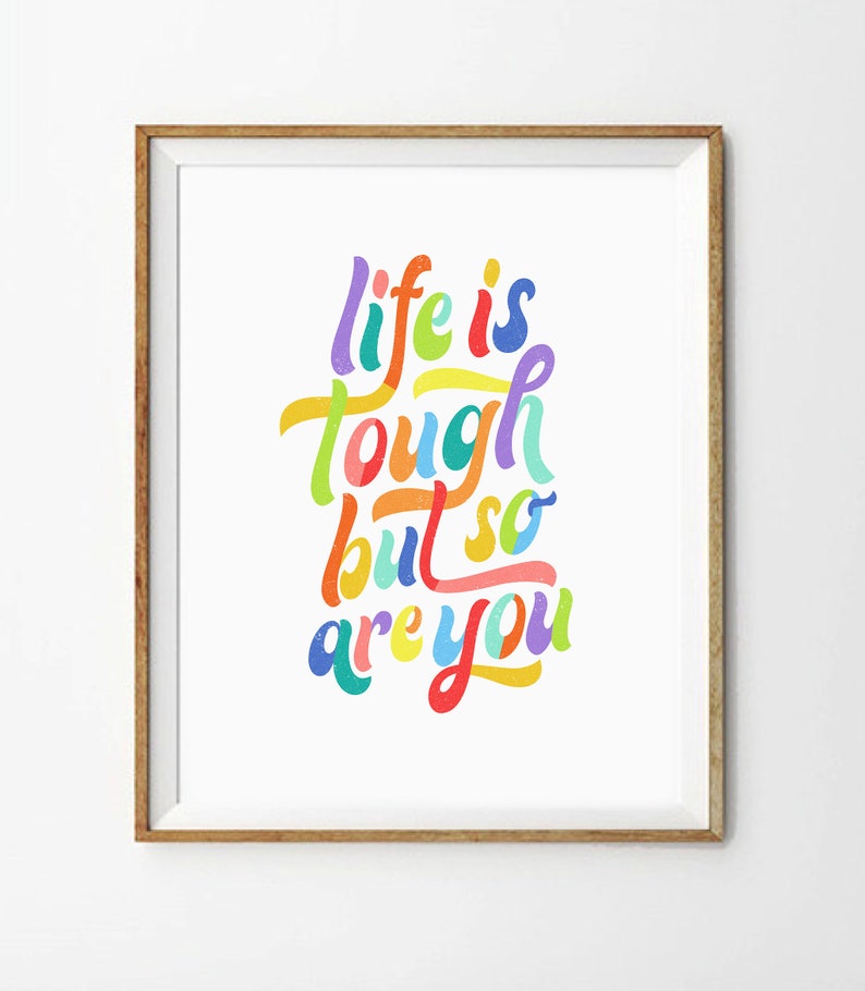 May include: A framed print with a colorful, handwritten quote that reads "life is tough but so are you".
