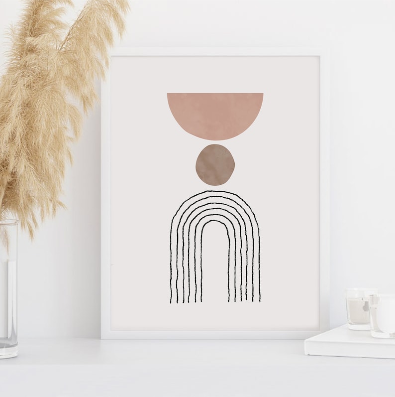 May include: Abstract art print with a pink half-circle, brown circle, and black and white rainbow arch design.