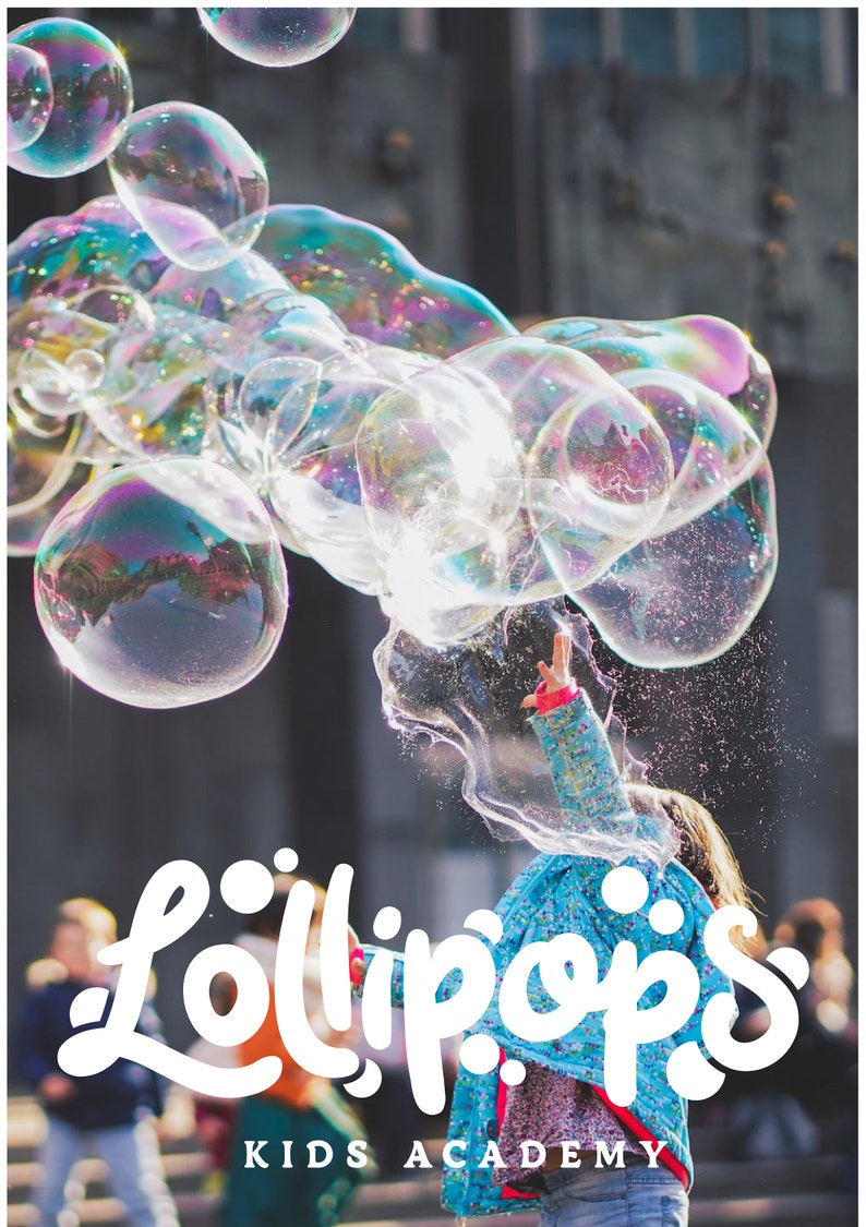 May include: A child in a blue jacket reaches towards a cluster of iridescent bubbles. The image features the text "Lollipops KIDS ACADEMY" in a playful, white font, suggesting a children's activity or educational program.