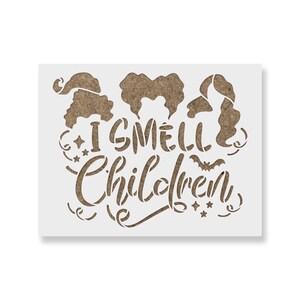May include: A brown stencil with the text "I smell children" and three witch silhouettes. The stencil is perfect for Halloween crafts.