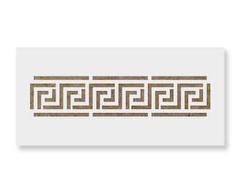 May include: A rectangular stencil featuring a repeating brown Greek key pattern. The design consists of three connected geometric meander motifs arranged horizontally, with clean cutouts creating the classic interlocking square lines.